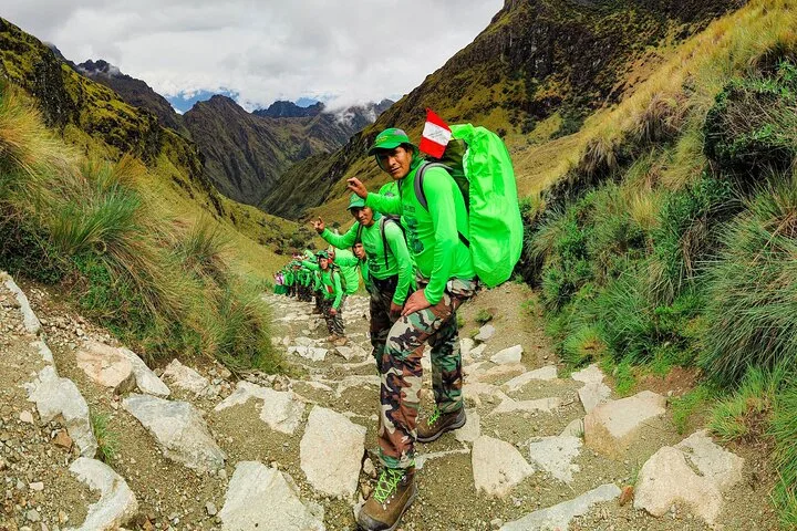 Trekkers crossing a high pass on the Classic Inca Trail during an Inca Trail tour to Machu Picchu, Cusco, Peru