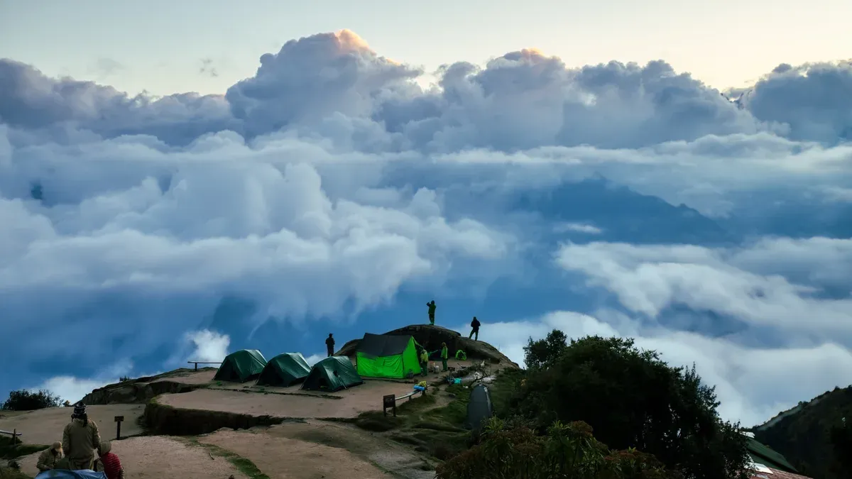 Tents pitched above the clouds at the Phuyupatamarca campsite, the third night on luxury Inca Trail tours